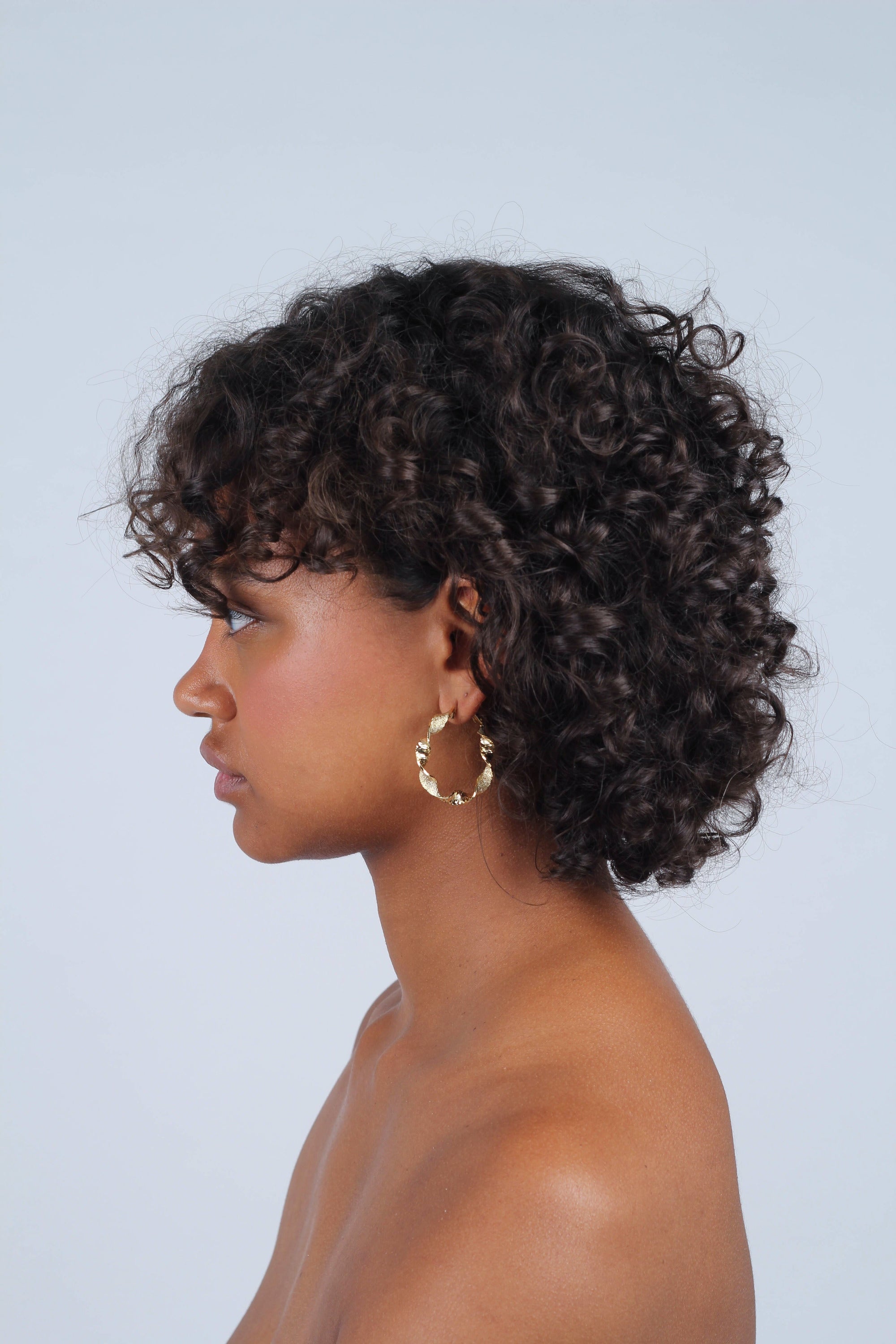 Gold rough smooth twisted hoop earrings_9