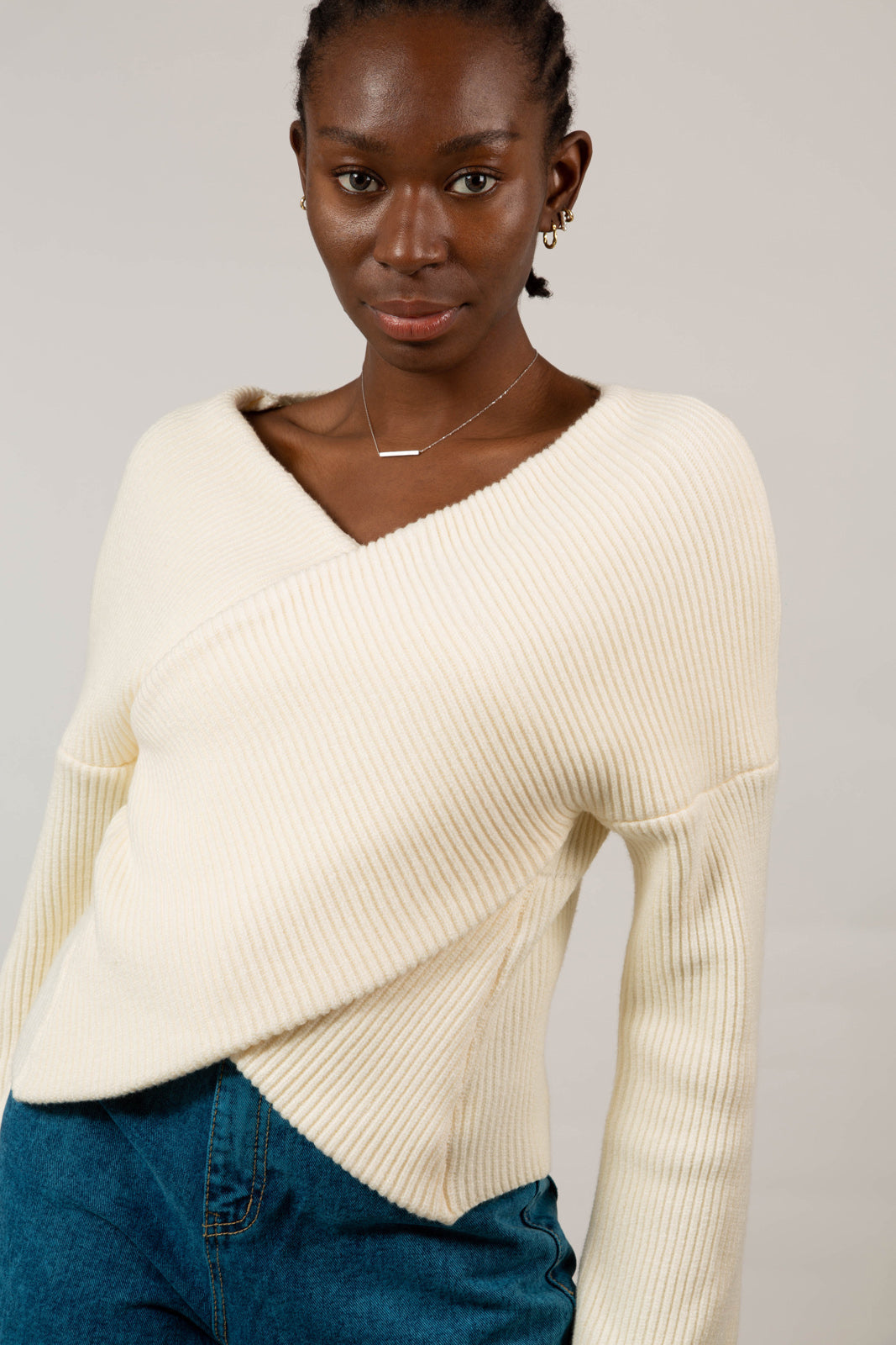 Ivory cross front panel knit top
