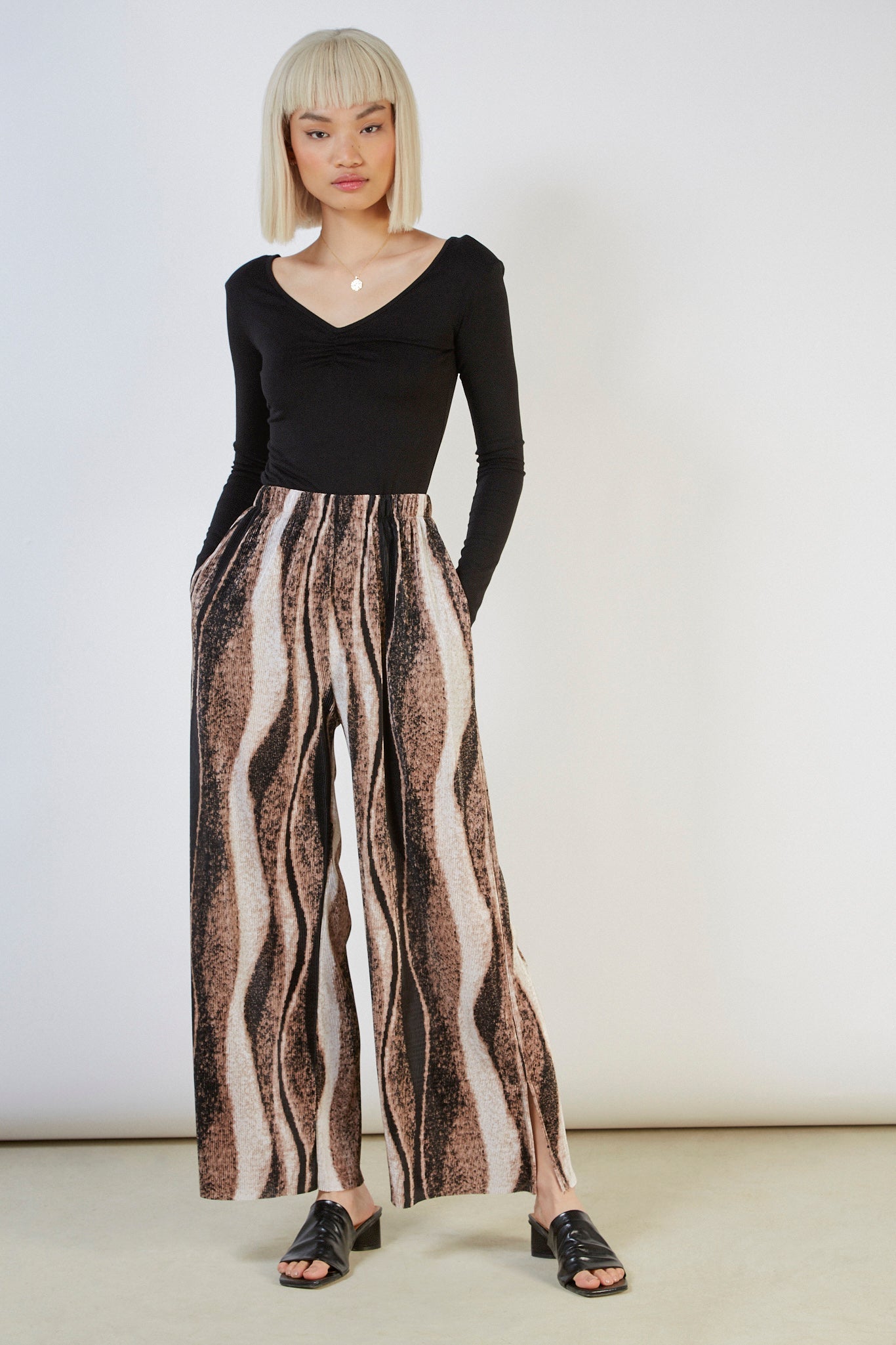 Beige and black abstract print trousers_2