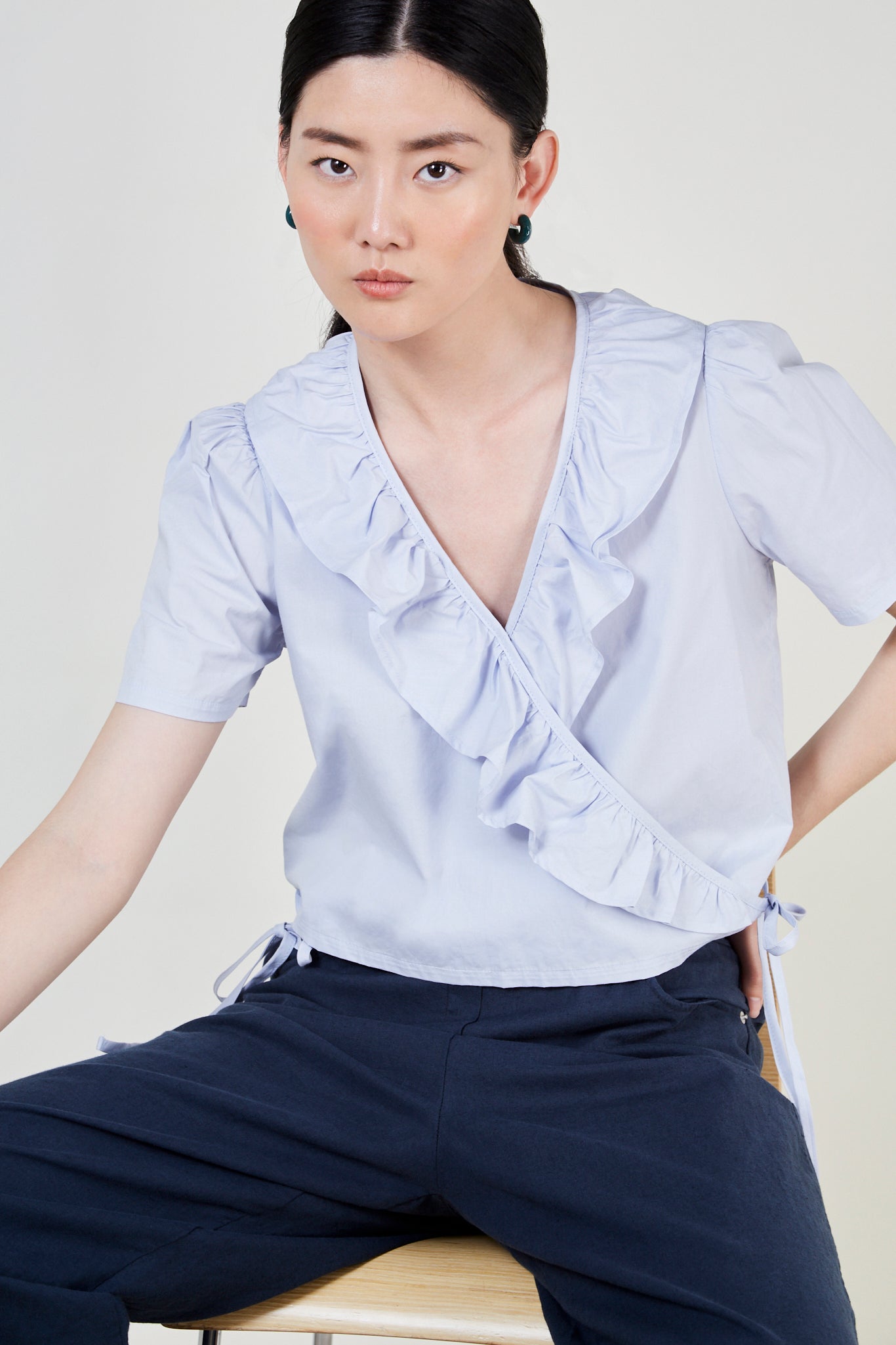 Light blue ruffle trim wrap top_1