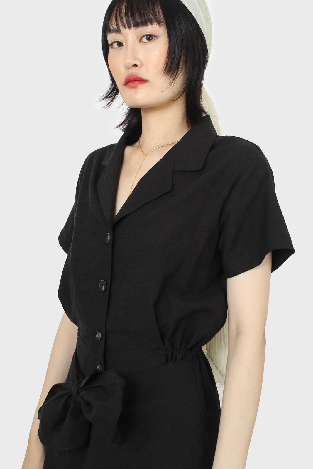 Black short sleeved button up tie waist romper_12