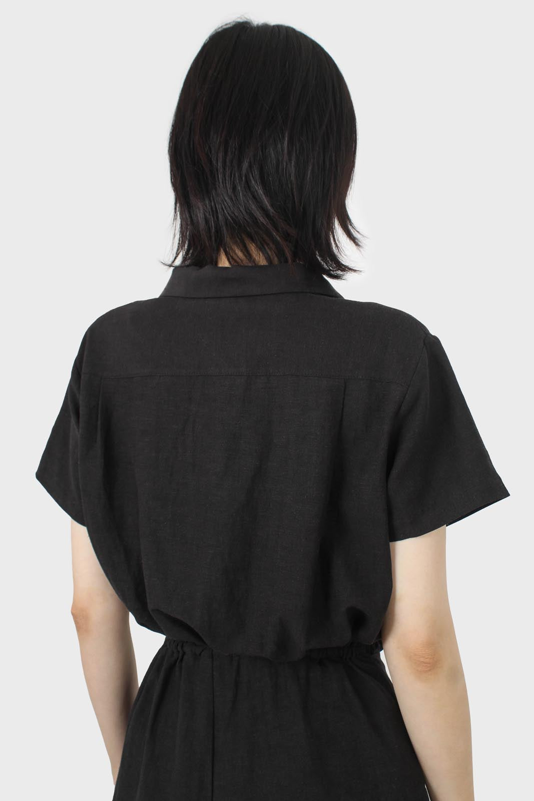 Black short sleeved button up tie waist romper_10