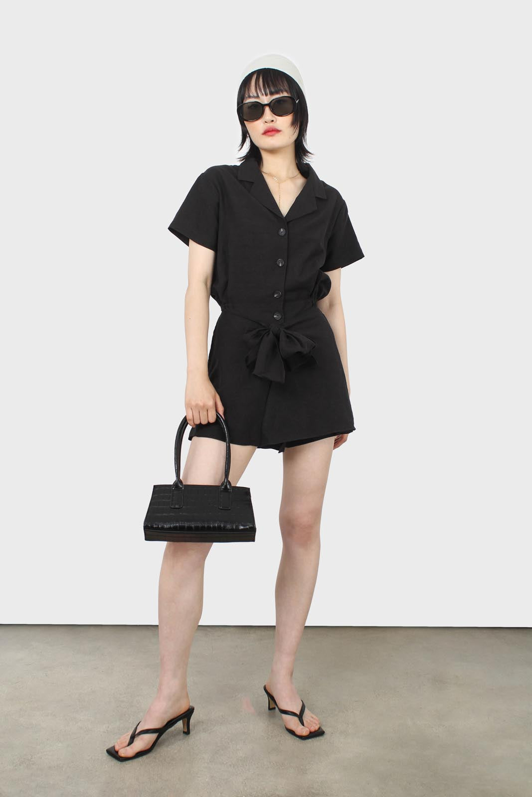 Black short sleeved button up tie waist romper_1