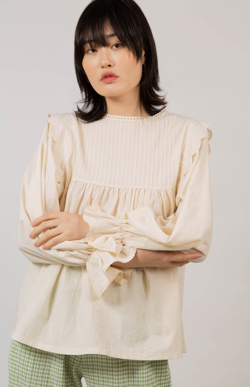 Beige ruffle trim seamed yoke blouse_1