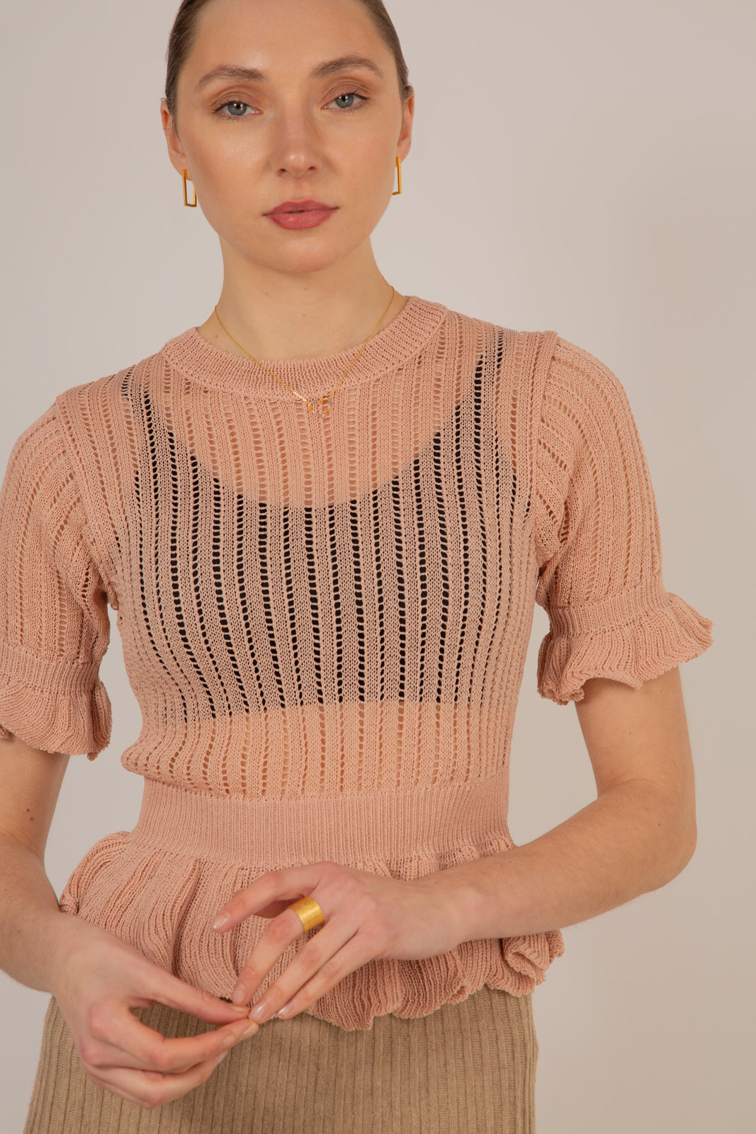 Pink sheer peplum knit top_1