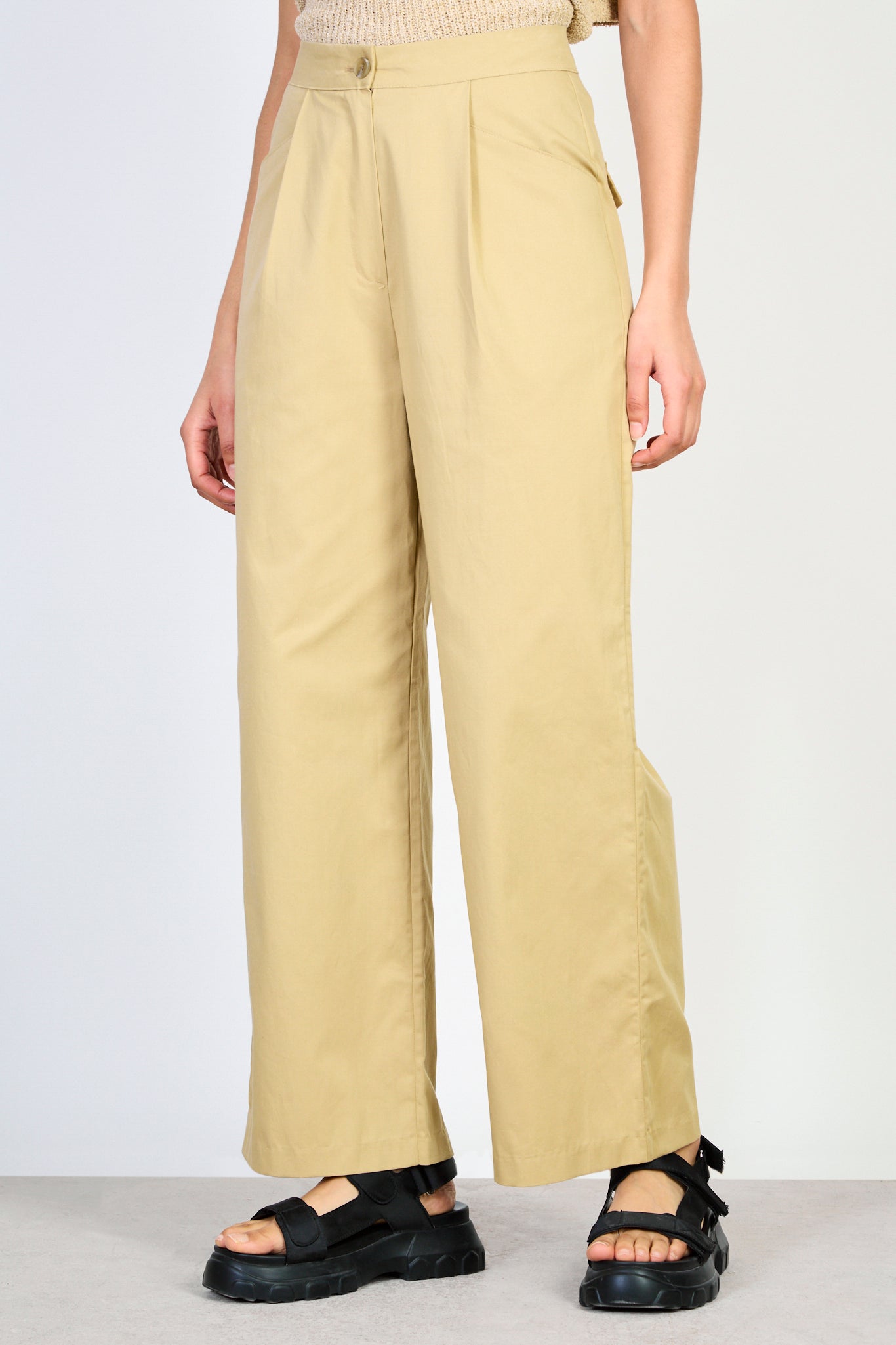 Beige pleat pocket relaxed trousers_1
