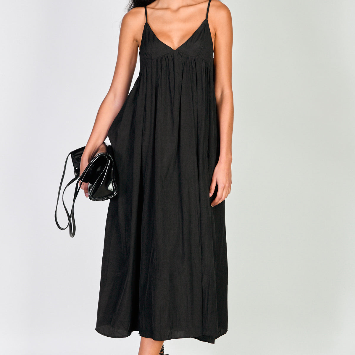 Black plunging neck spaghetti strap dress