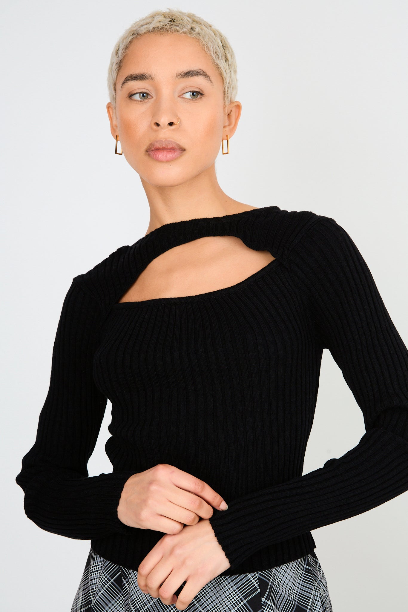 Black ribbed peek front knit top_1