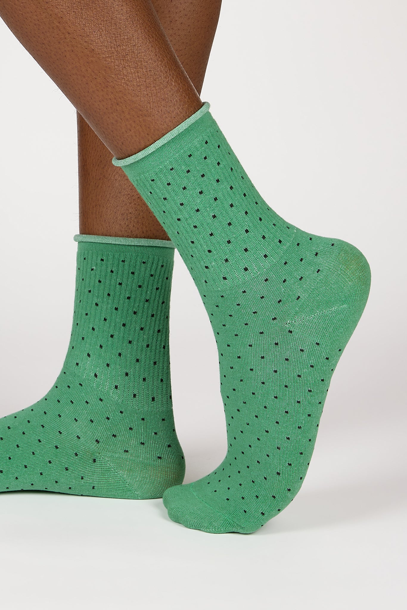 Green and black polka dot roll trim socks_1