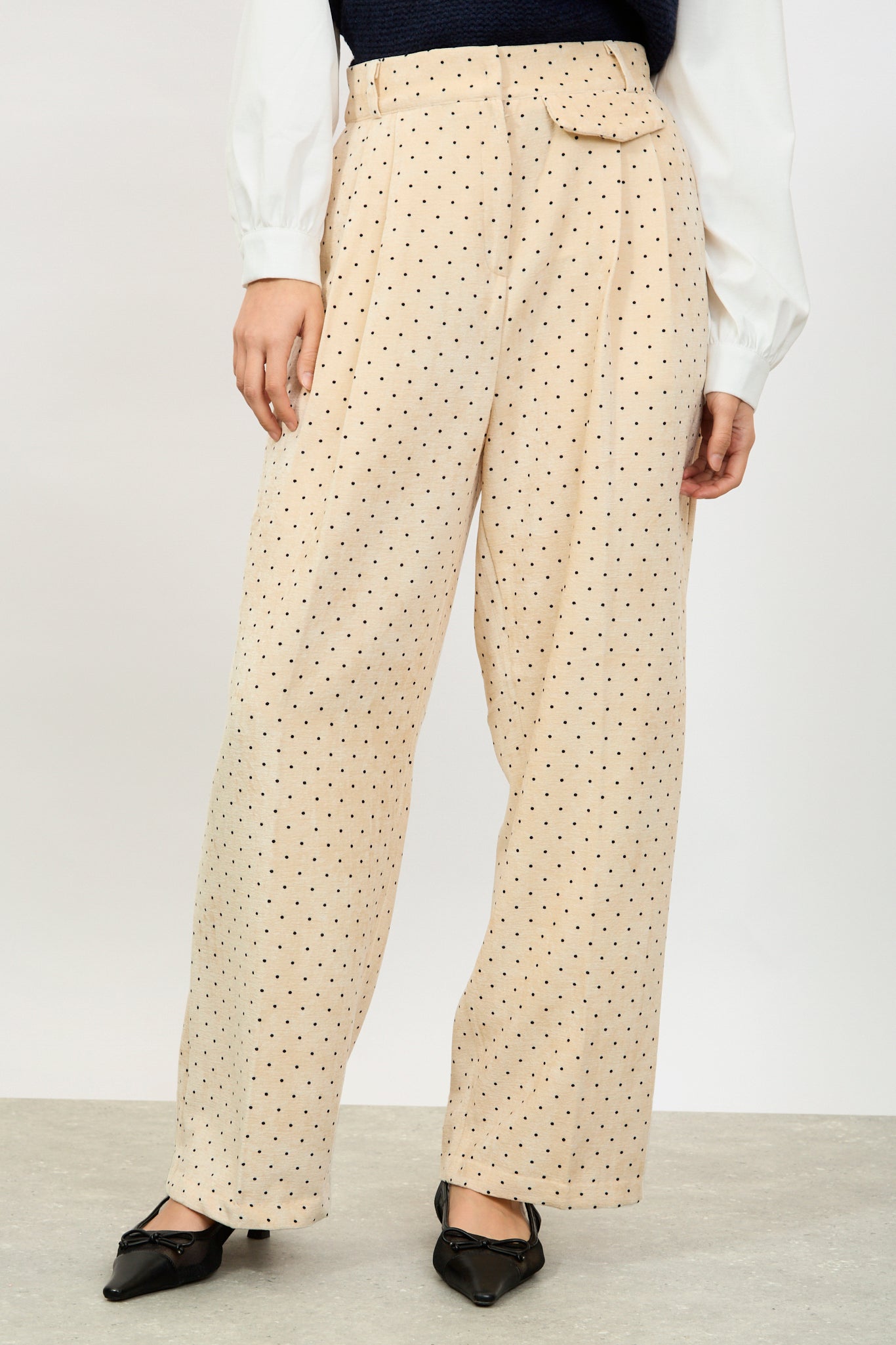 Ivory polka dot flap pocket trousers_1