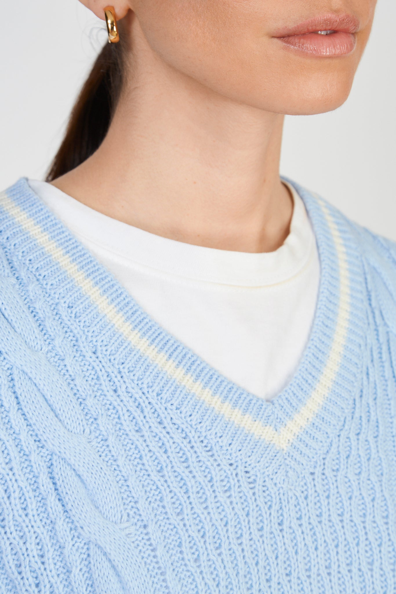 Light blue and ivory varsity trim sweater vest