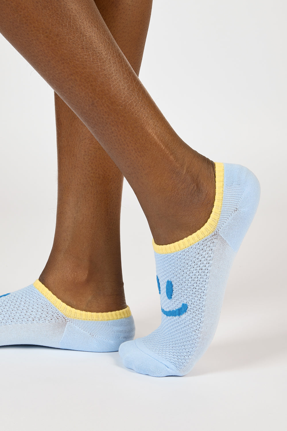 Light blue and yellow giant smiley face pop socks_4