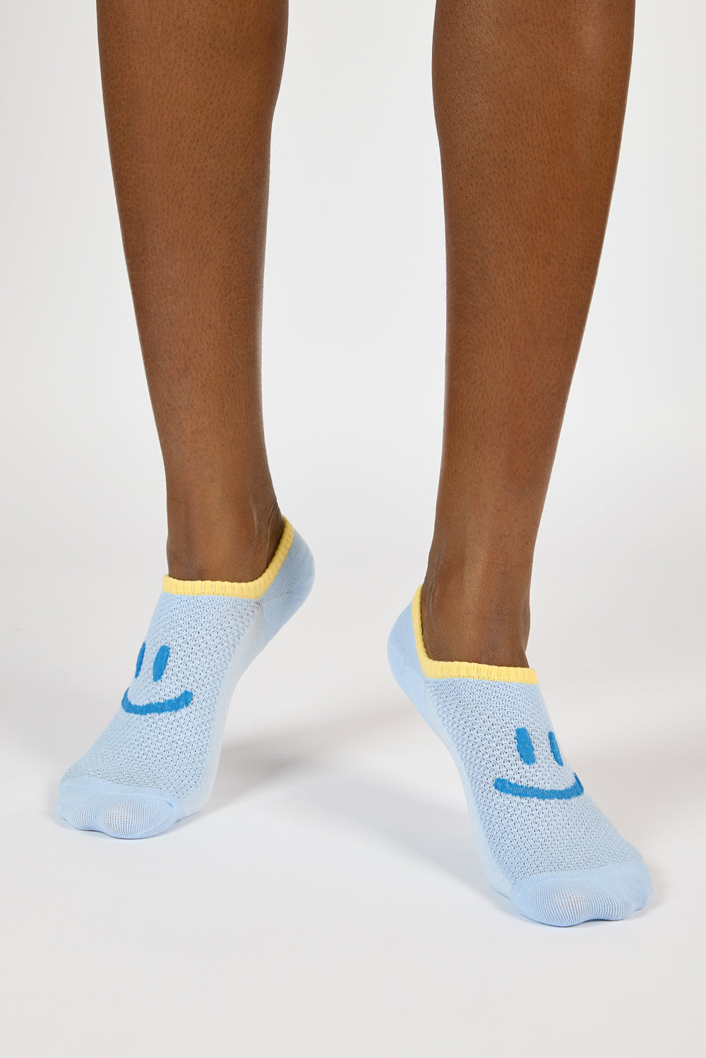 Light blue and yellow giant smiley face pop socks_3