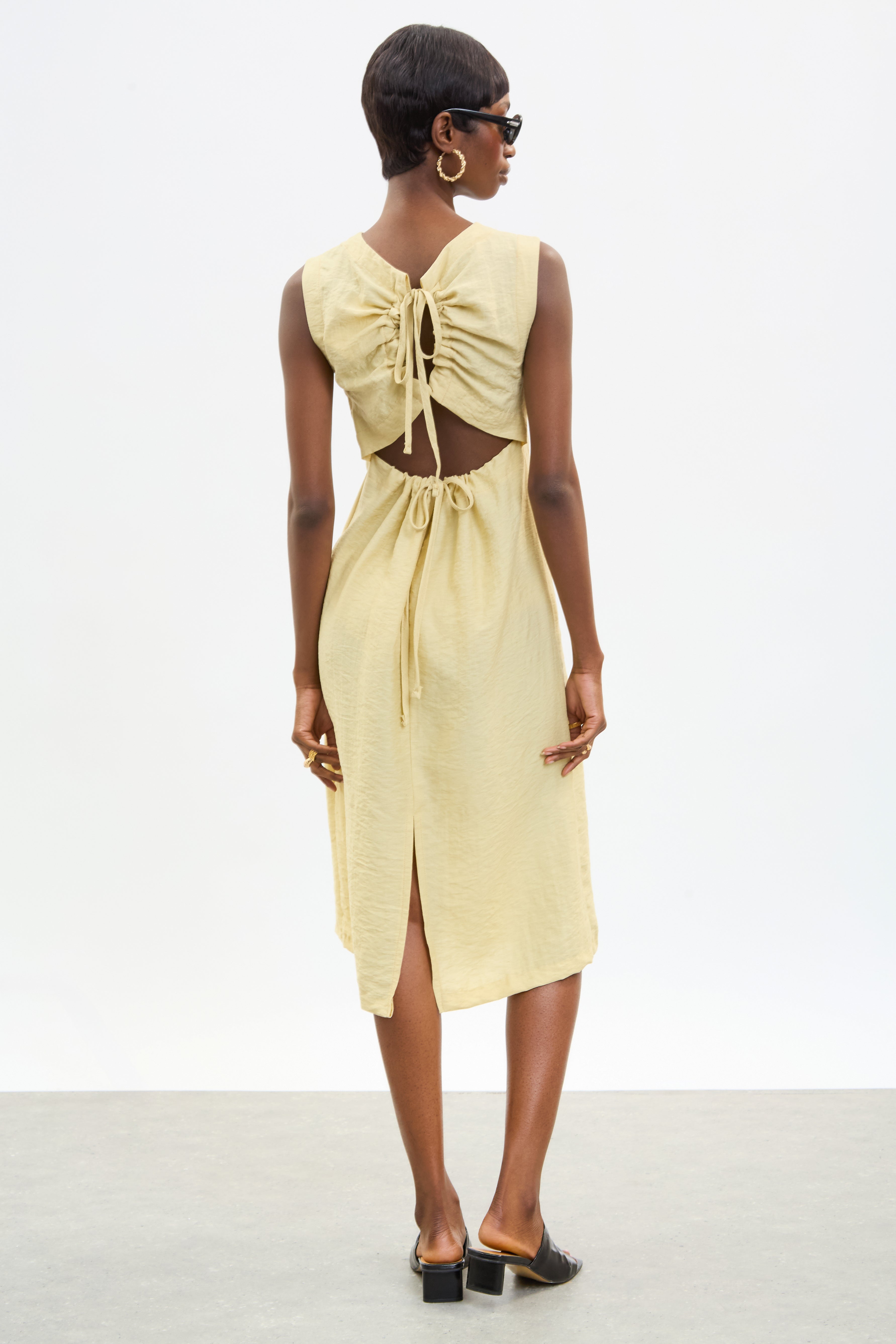 Pale yellow tie up peek back dress_1