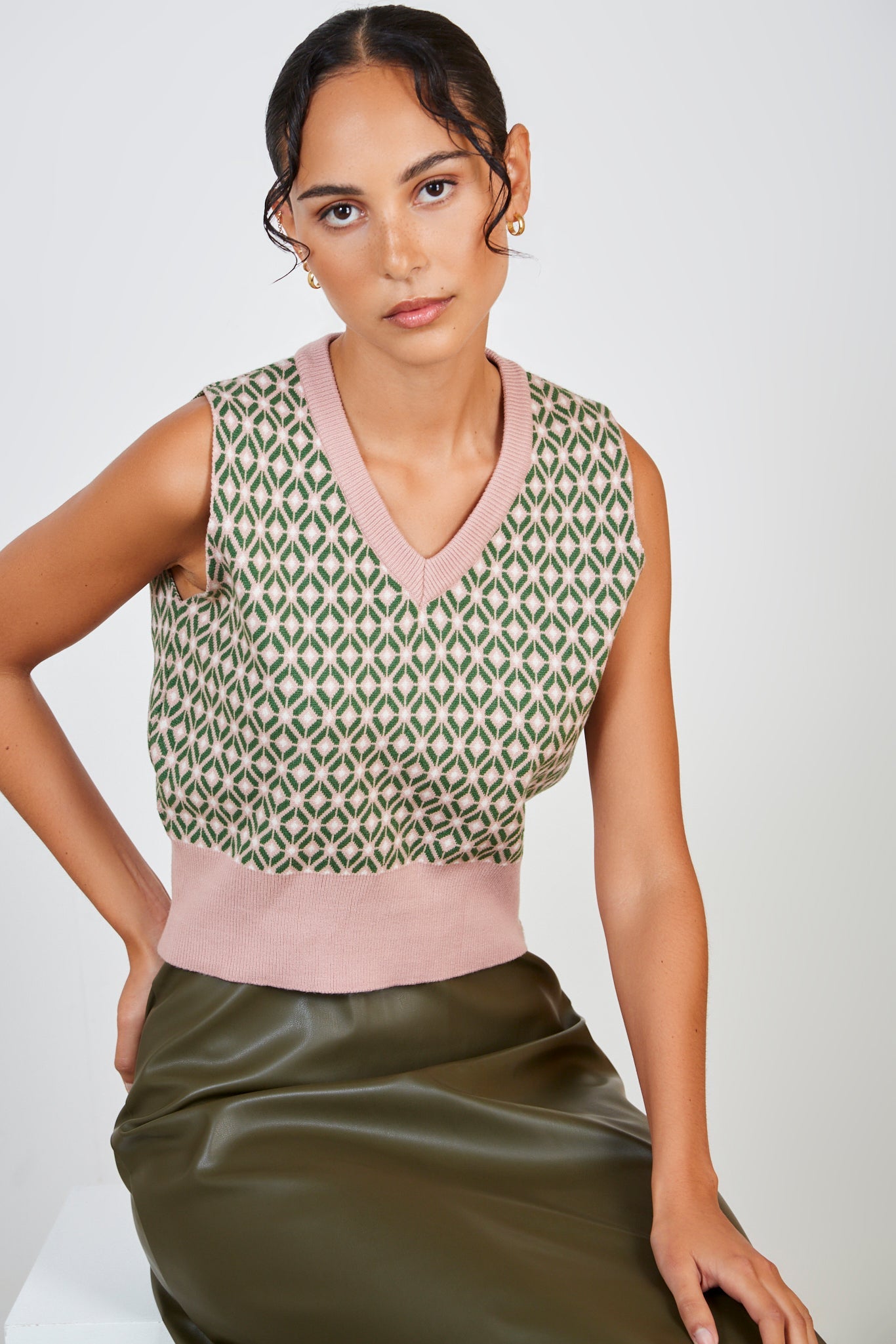 Pink and green geometric sweater vest