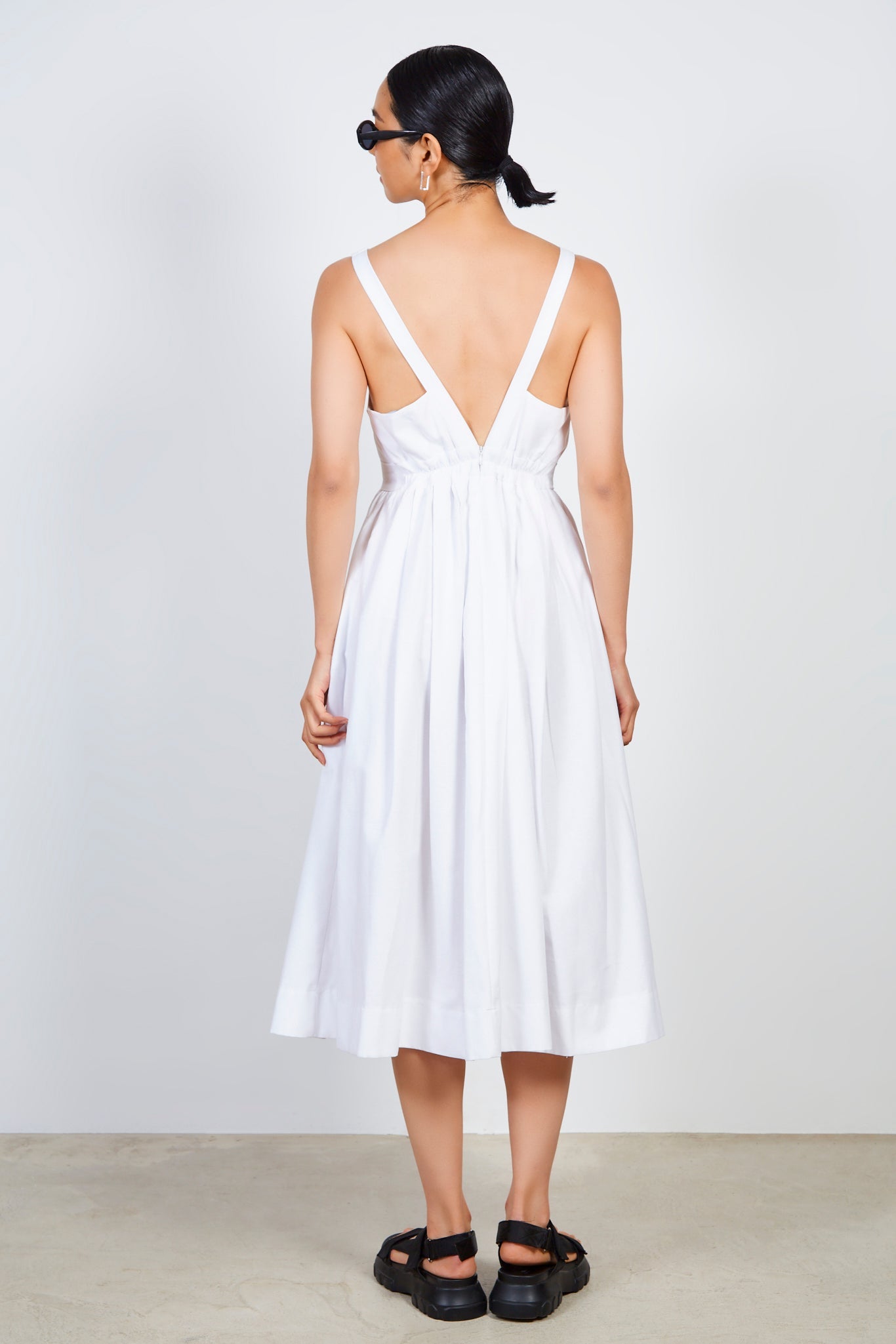 White plunging V back dress
