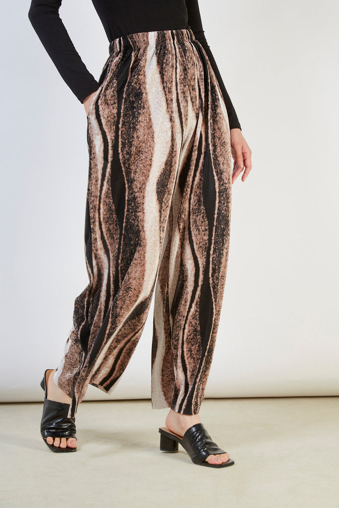 Beige and black abstract print trousers_1