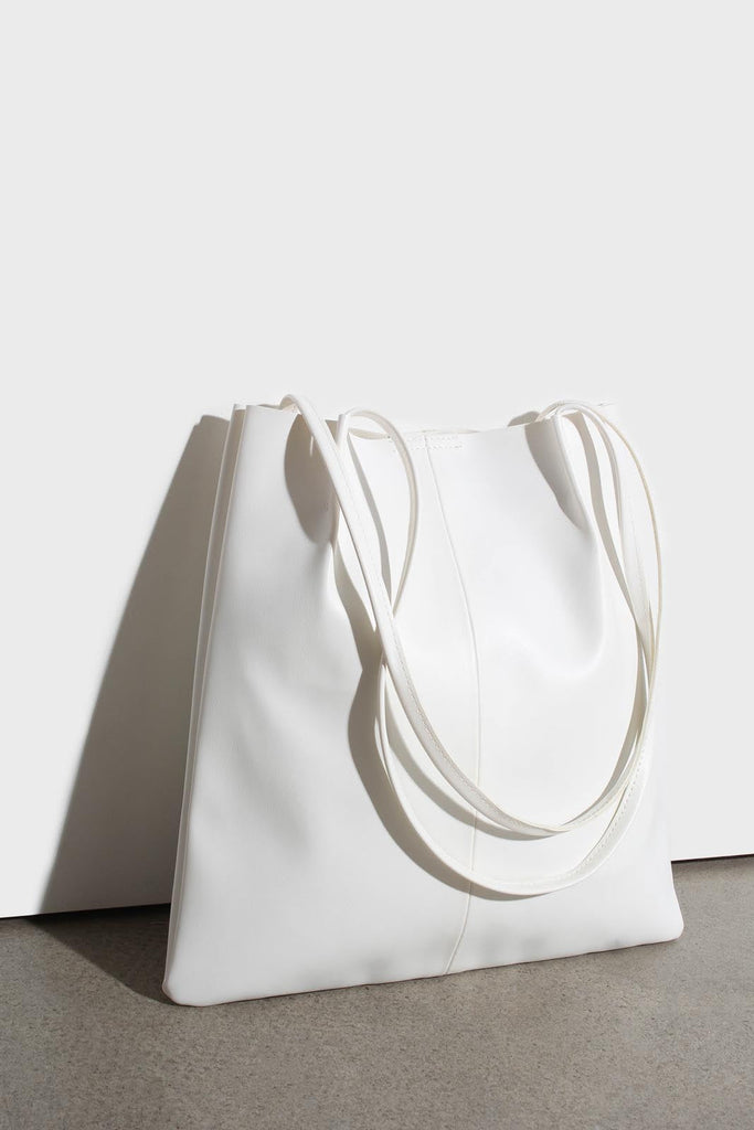 Ivory vegan leather pinched strap tote bag_1