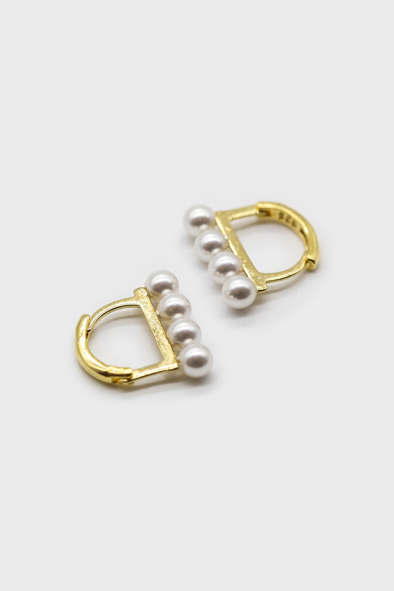 small pearl D earrings
