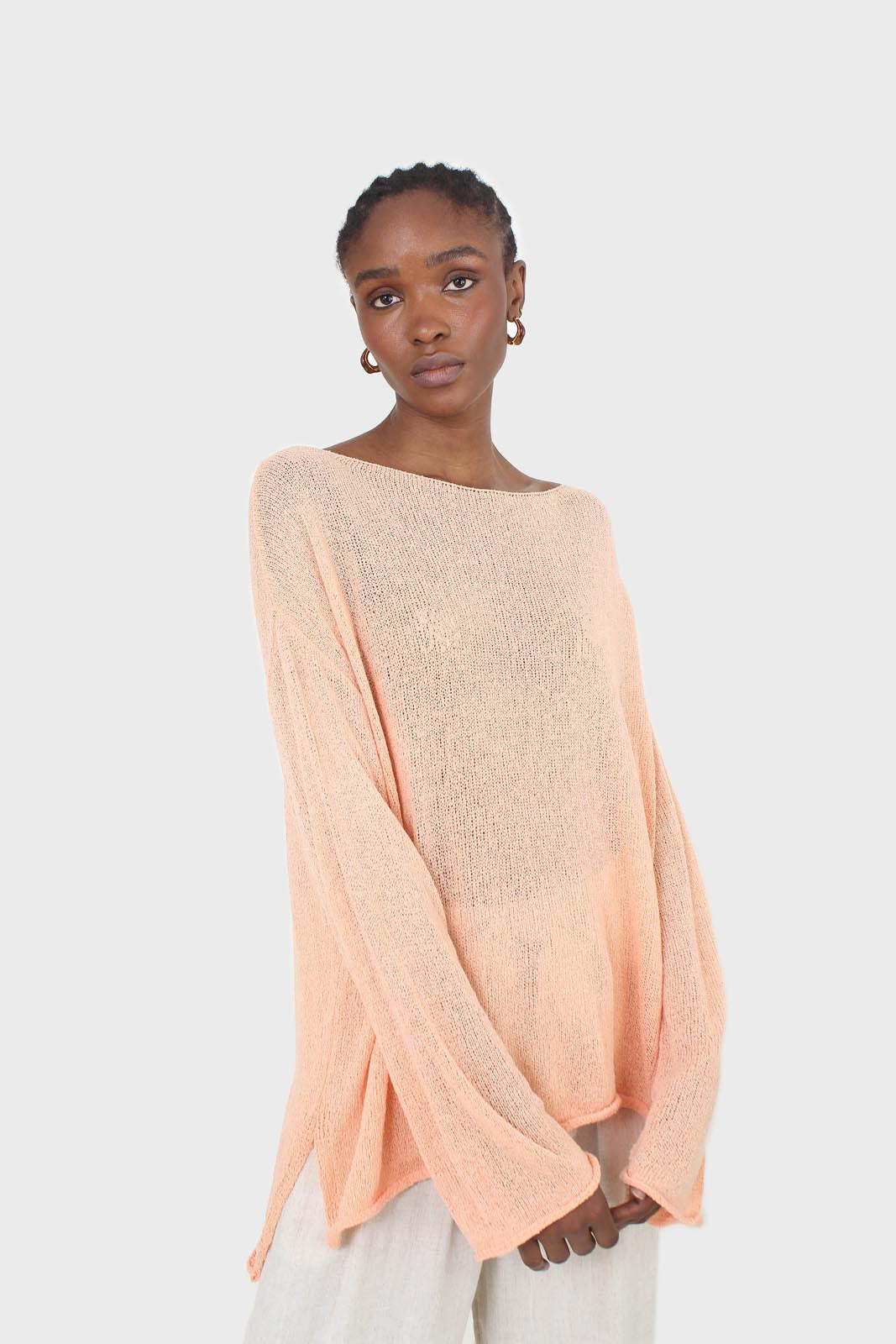 Pale orange wide neck long sleeved loose knit top_1