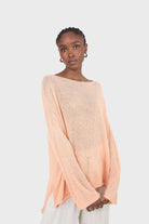 Pale orange wide neck long sleeved loose knit top_1