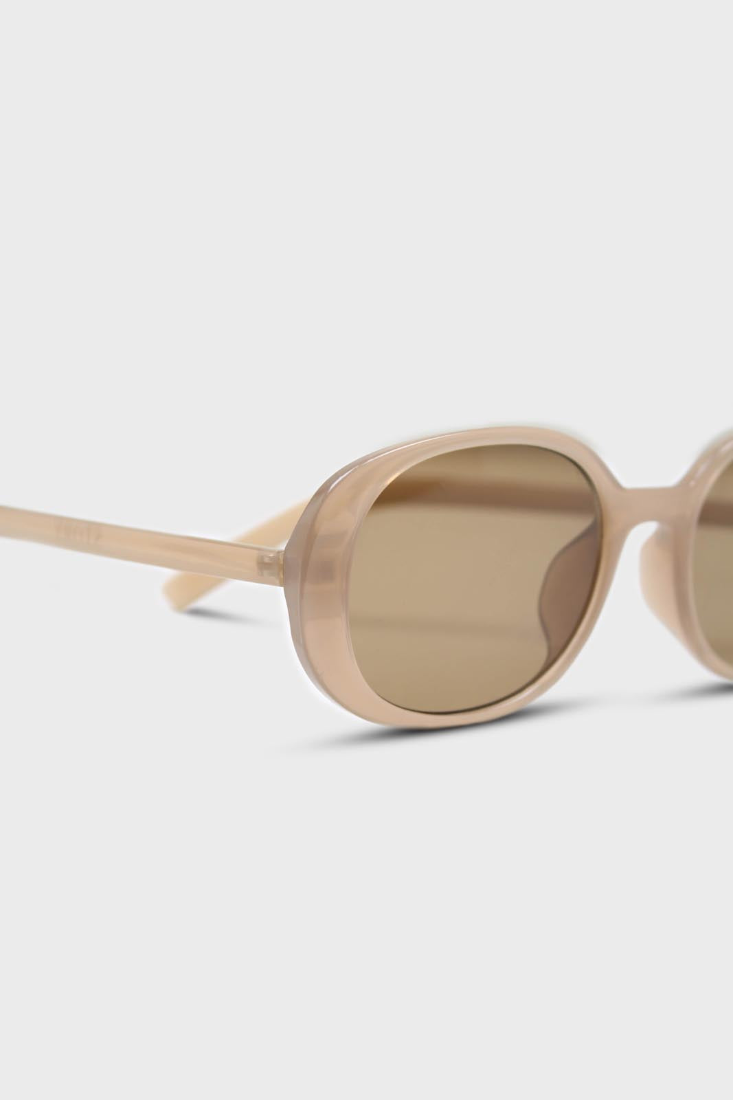 All beige thick oval frame sunglasses