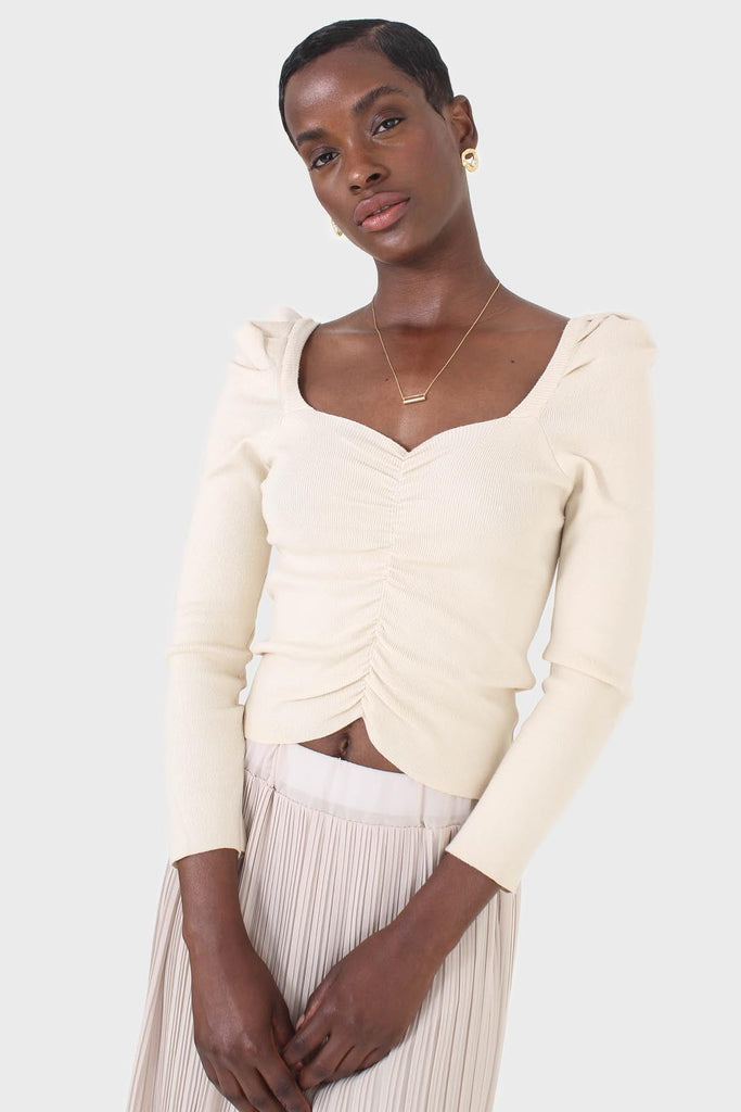 Beige gathered front long sleeved knit top_1