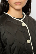 Black and ivory fuzzy lined circle quilted jacket_3