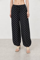 Black and white polka dot linen blend slouchy trousers_1