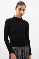 Black textured long sleeve mock neck top_1