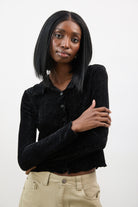 Black textured velvet ruffle trim long sleeve top_1