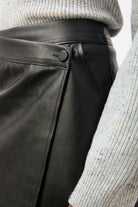 Black vegan leather asymmetric wrap mini skirt_4
