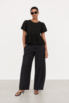 Black textured puff short sleeve tiered blouse_4