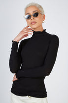 Black ribbed mock neck ruffle trim top_1