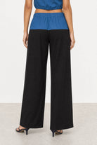 Blue denim and black jersey trousers_4
