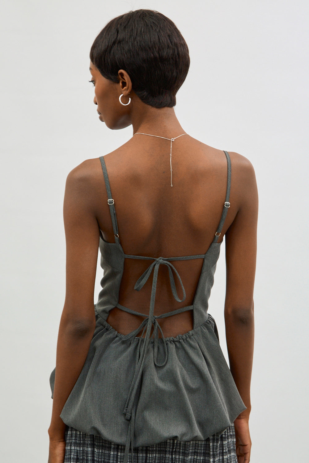 Charcoal grey open back peplum top | Glassworks London