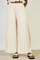 Cream silky pleated trousers_1