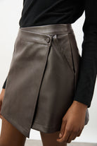 Dark brown vegan leather asymmetric wrap mini skirt_3