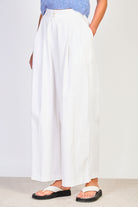 Ivory pleated wide leg trousers_1