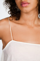 Ivory slim strap ruffle hem tank_3