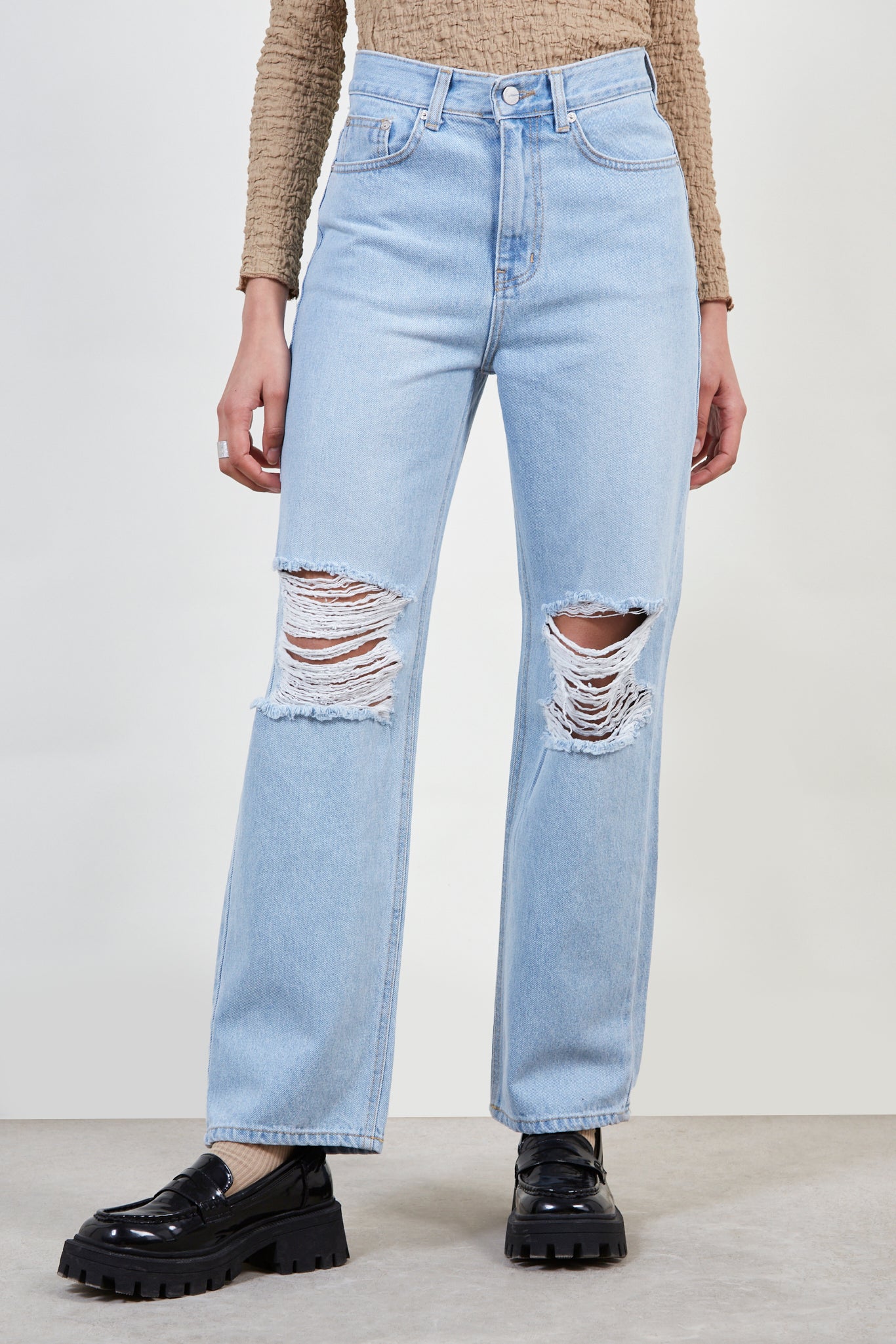 Light blue ripped knee jeans