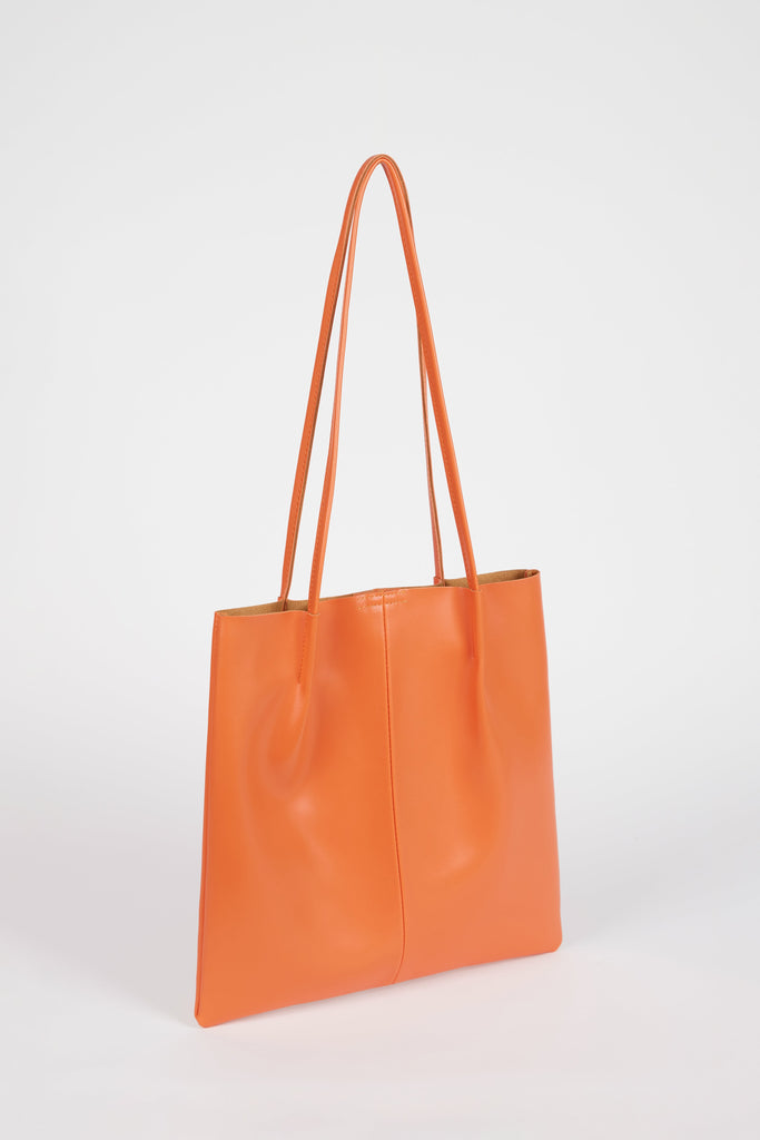 Orange vegan leather pinched strap tote bag_2