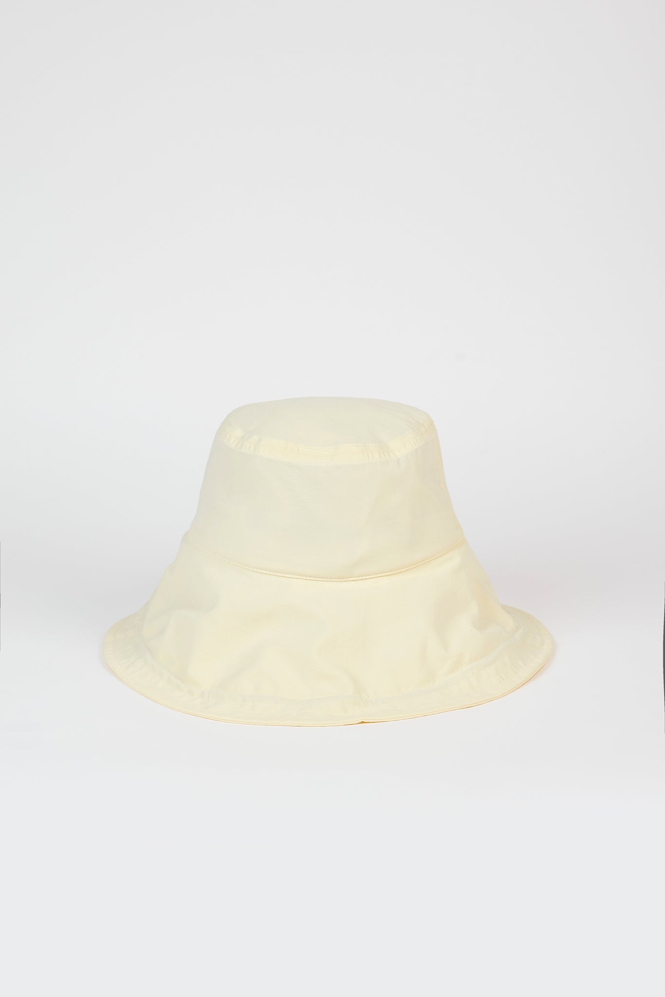 Pale yellow nylon wide brim bucket hat_1
