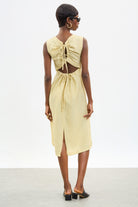 Pale yellow tie up peek back dress_1