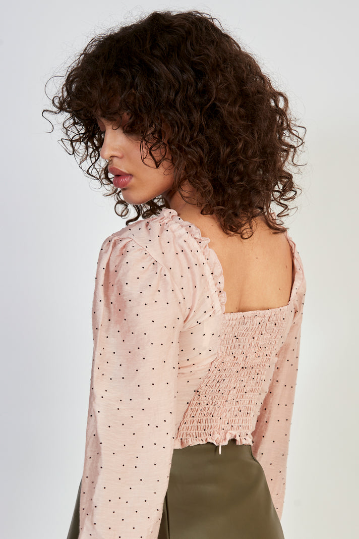 Pink and black polka dot blouse