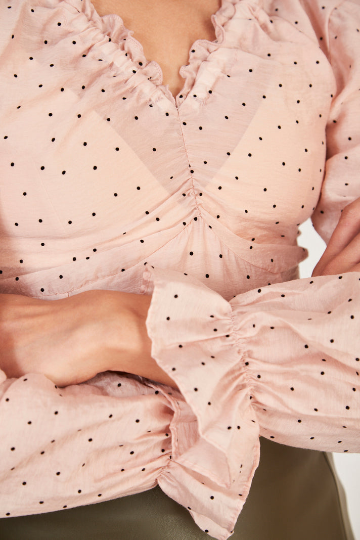 Pink and black polka dot blouse