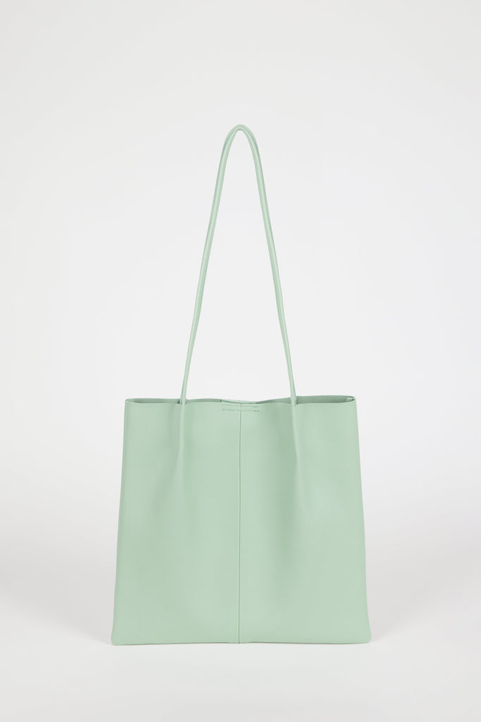 Sage green vegan leather pinched strap tote bag_1