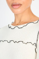 White and black horizontal trim long sleeved top_3