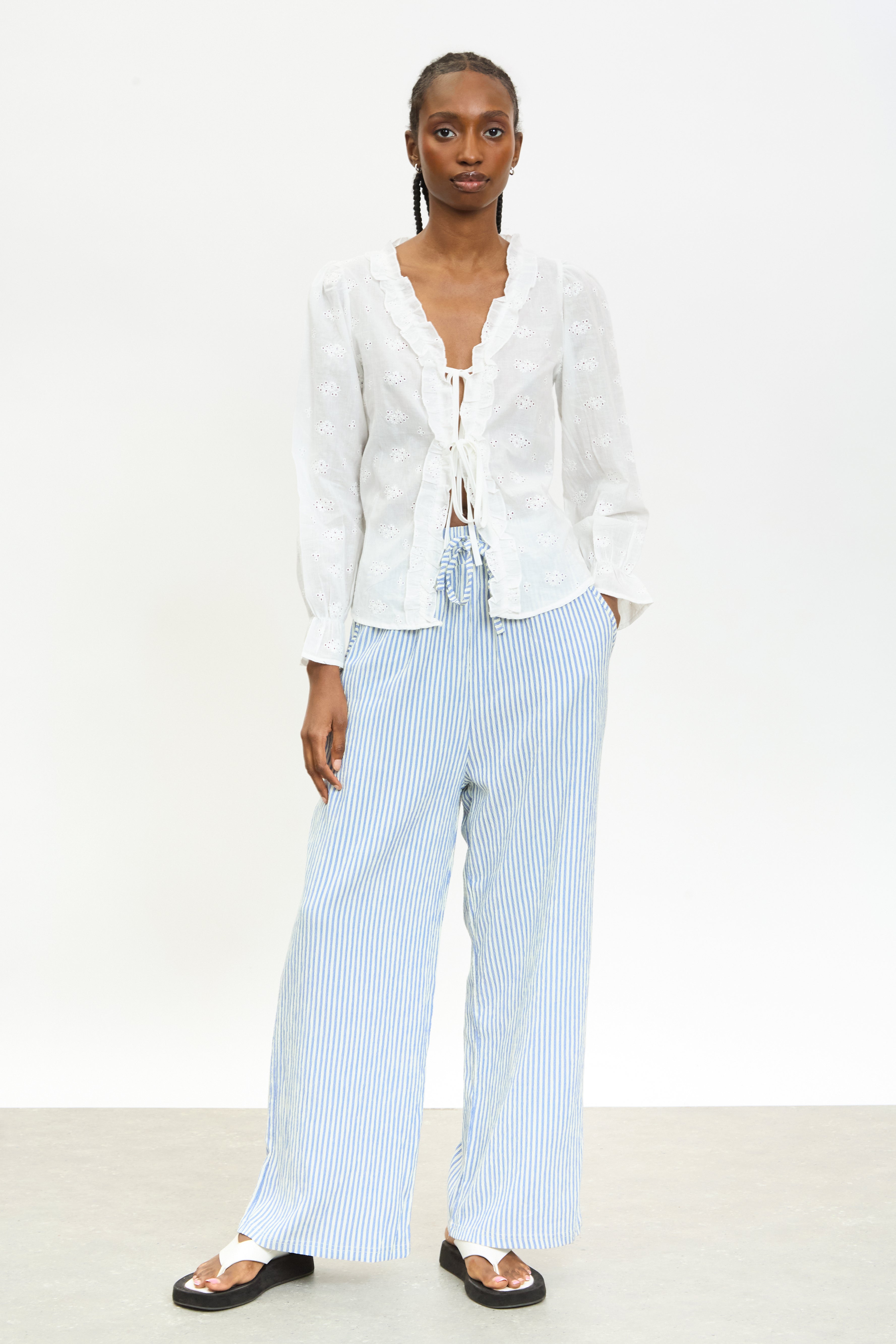 White embroidered frill trim tie front blouse | Glassworks London