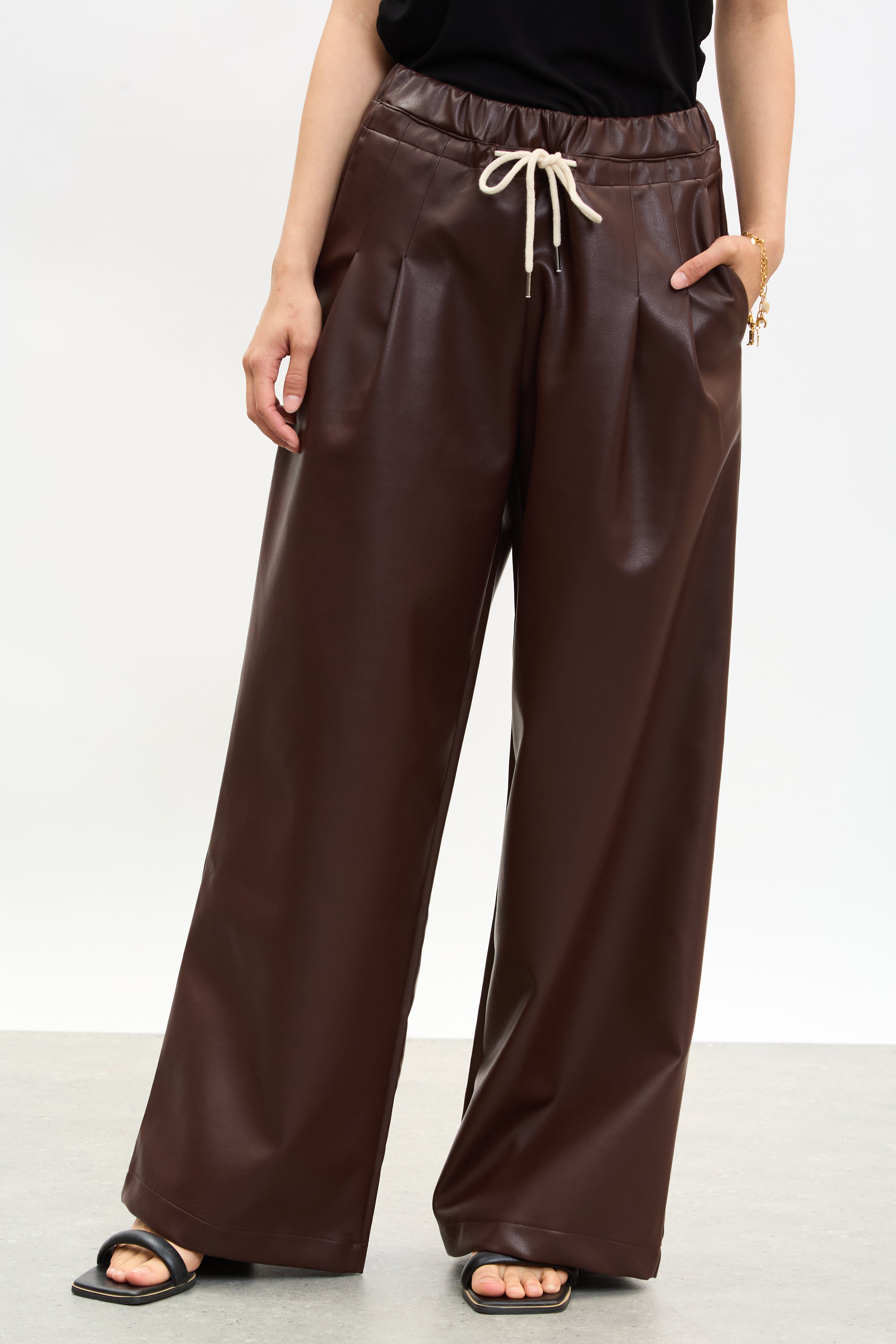Burgundy vegan leather pleated drawstring trousers_1